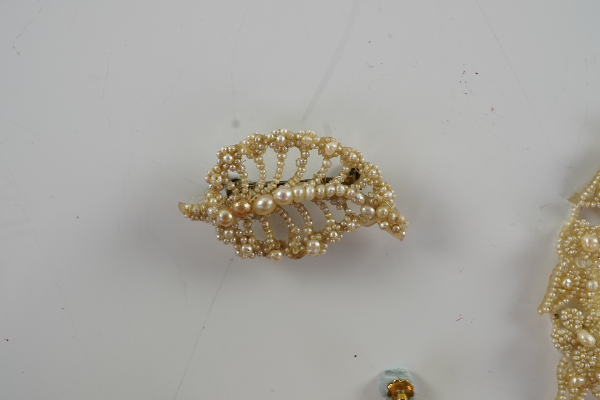 A Regency seed pearl necklace, brooch and pair of earrings, early 19th century